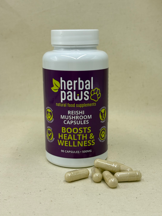 A white plastic bottle of Herbal Paws Reishi Mushroom Capsules with a dark purple label, shown on a beige textured background with several capsules placed in front. Herbal Paws